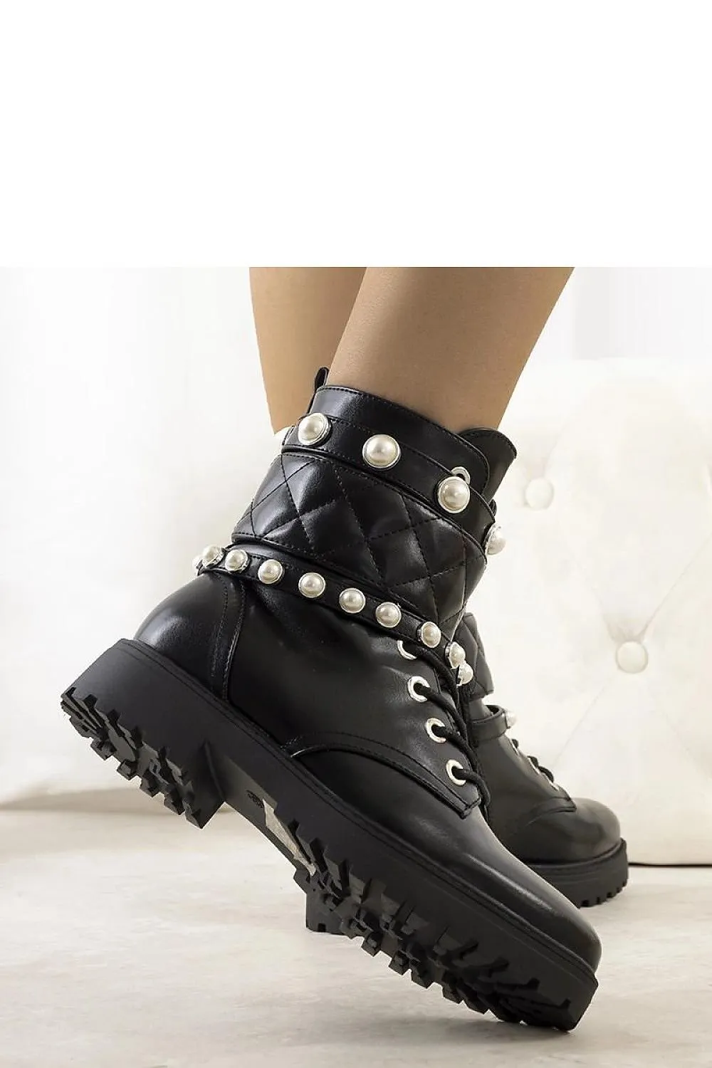 Black synthetic leather boots